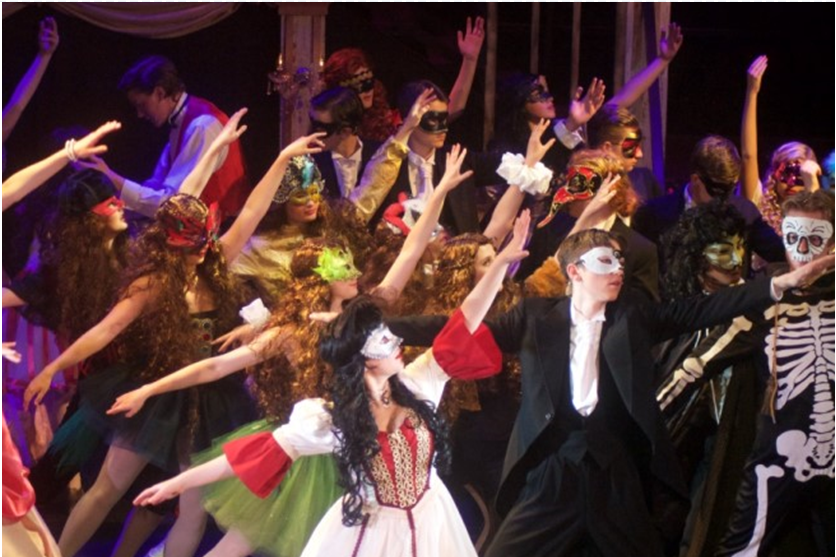 Dancers on stage at Derby Youth Musical Theatre's 2015 performance of Phantom of the Opera